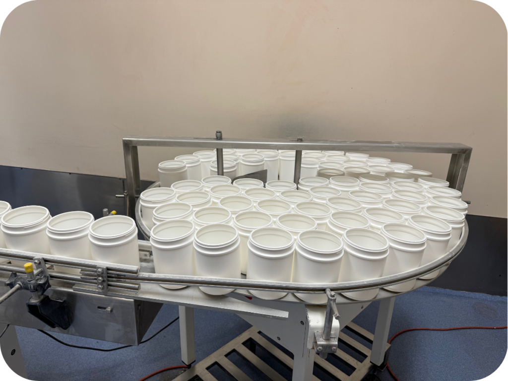 empty tub packaging on a conveyor belt