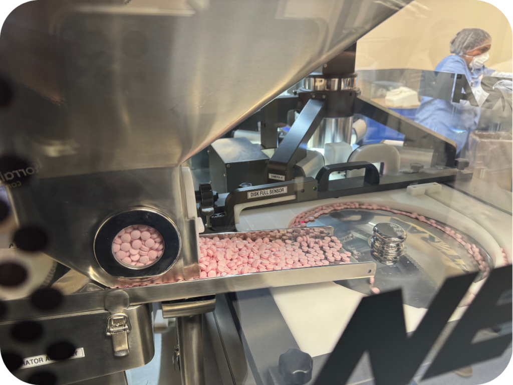 pink tablets in production machine