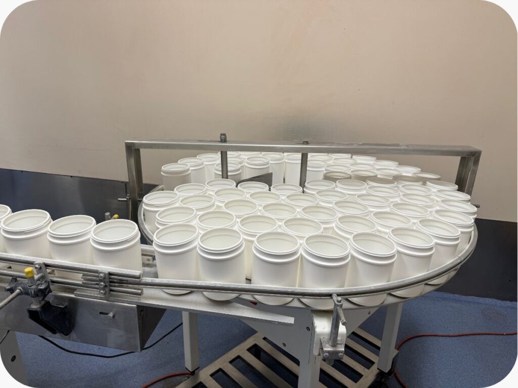 supplement bottles on a conveyor belt
