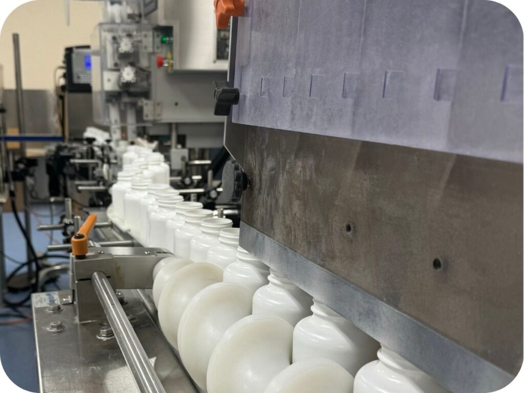 lids being added to bottles