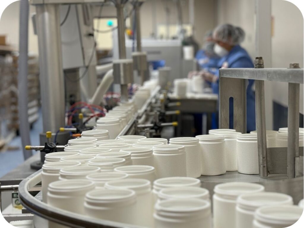 supplements bottles on an assembly line