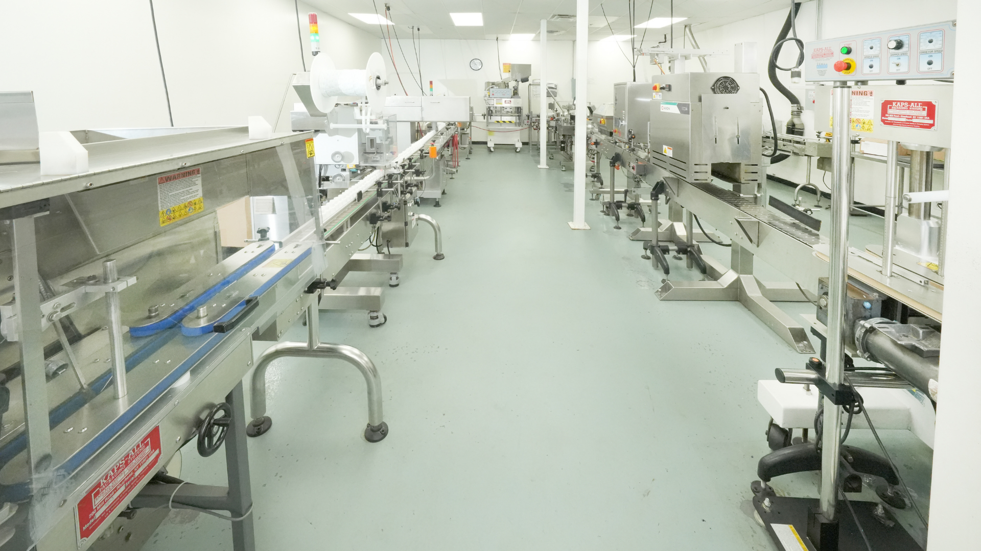 A clean, modern pharmaceutical laboratory banner featuring advanced digital testing equipment and diagnostic screens.